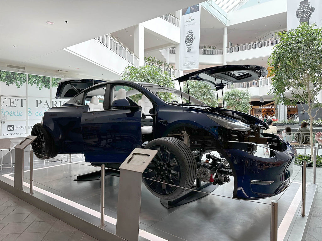 Tesla puts an exploded view Model Y on display at the Mall of America